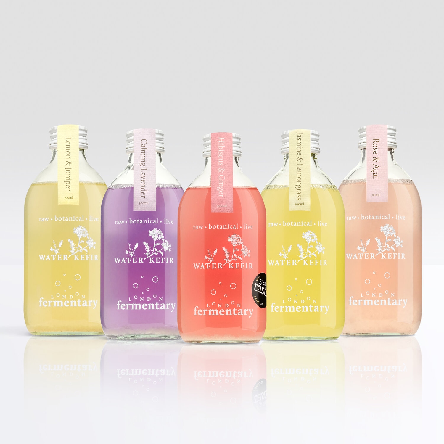 Five London Fermentary water kefir bottles in assorted flavors, including Lemon & Juniper, Calming Lavender, Hibiscus & Ginger, Jasmine & Lemongrass, and Rose & Açaí.