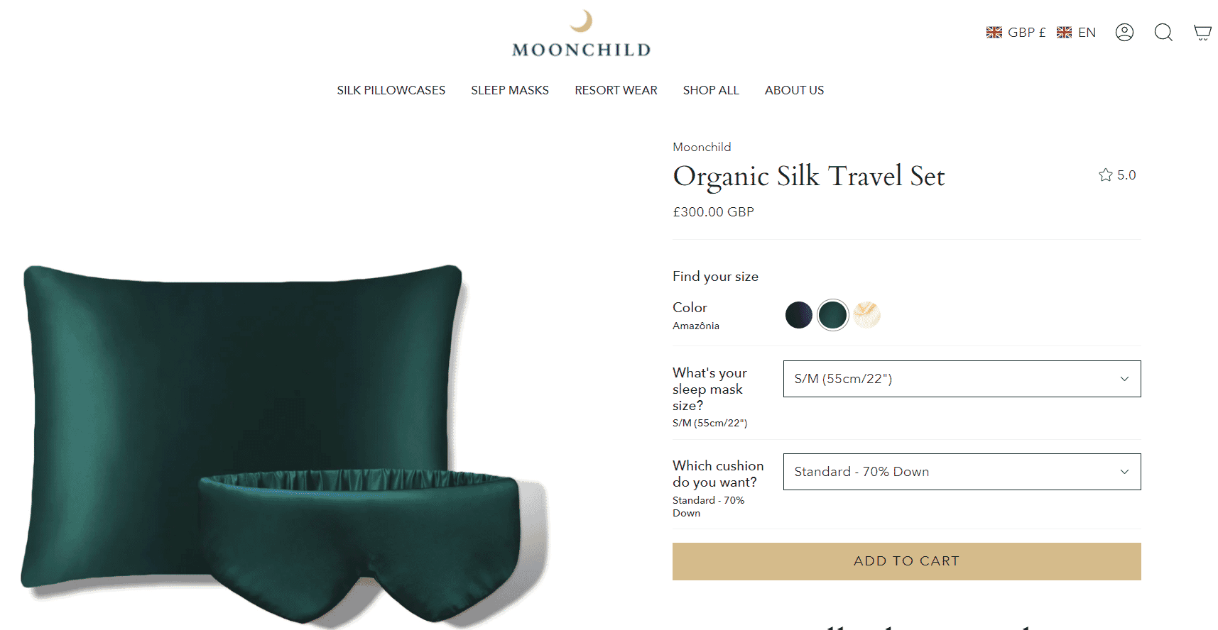 Organic silk travel set featuring a green silk pillowcase and matching sleep mask displayed on Moonchild product page.