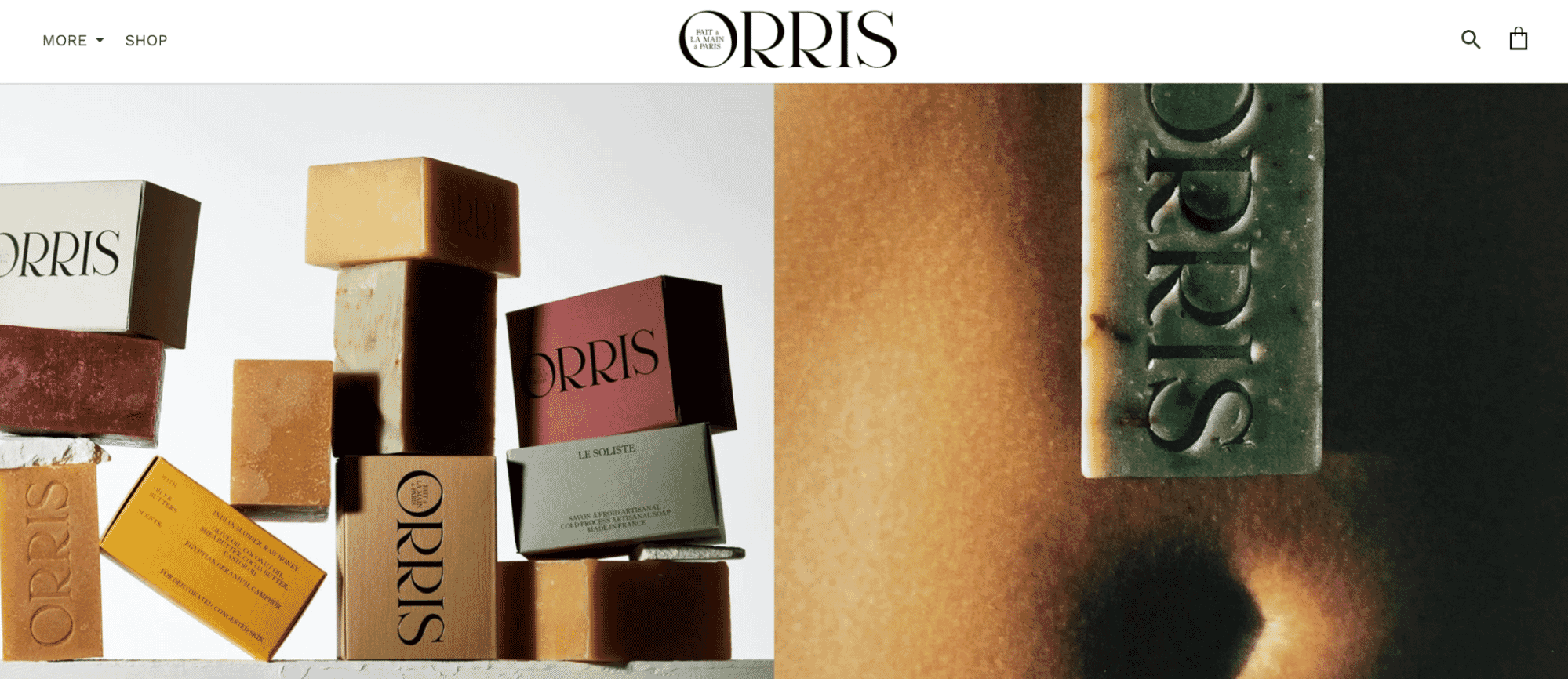 Stacked Orris artisan soaps with embossed branding in various colors and packaging