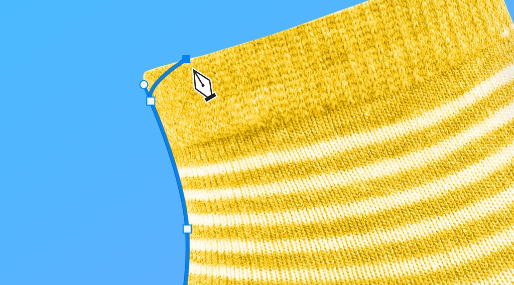 Photoshop Pen Tool adjusting a curved path with anchor points on the edge of a yellow striped sock against a blue background.