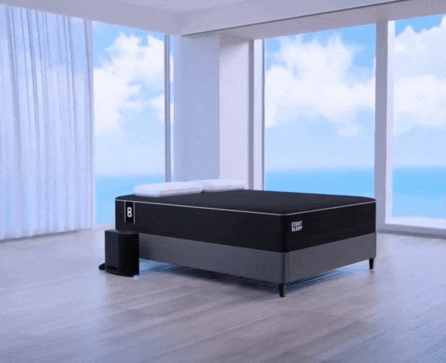 Eight Sleep smart bed in a modern, open bedroom with ocean view, featuring temperature control technology