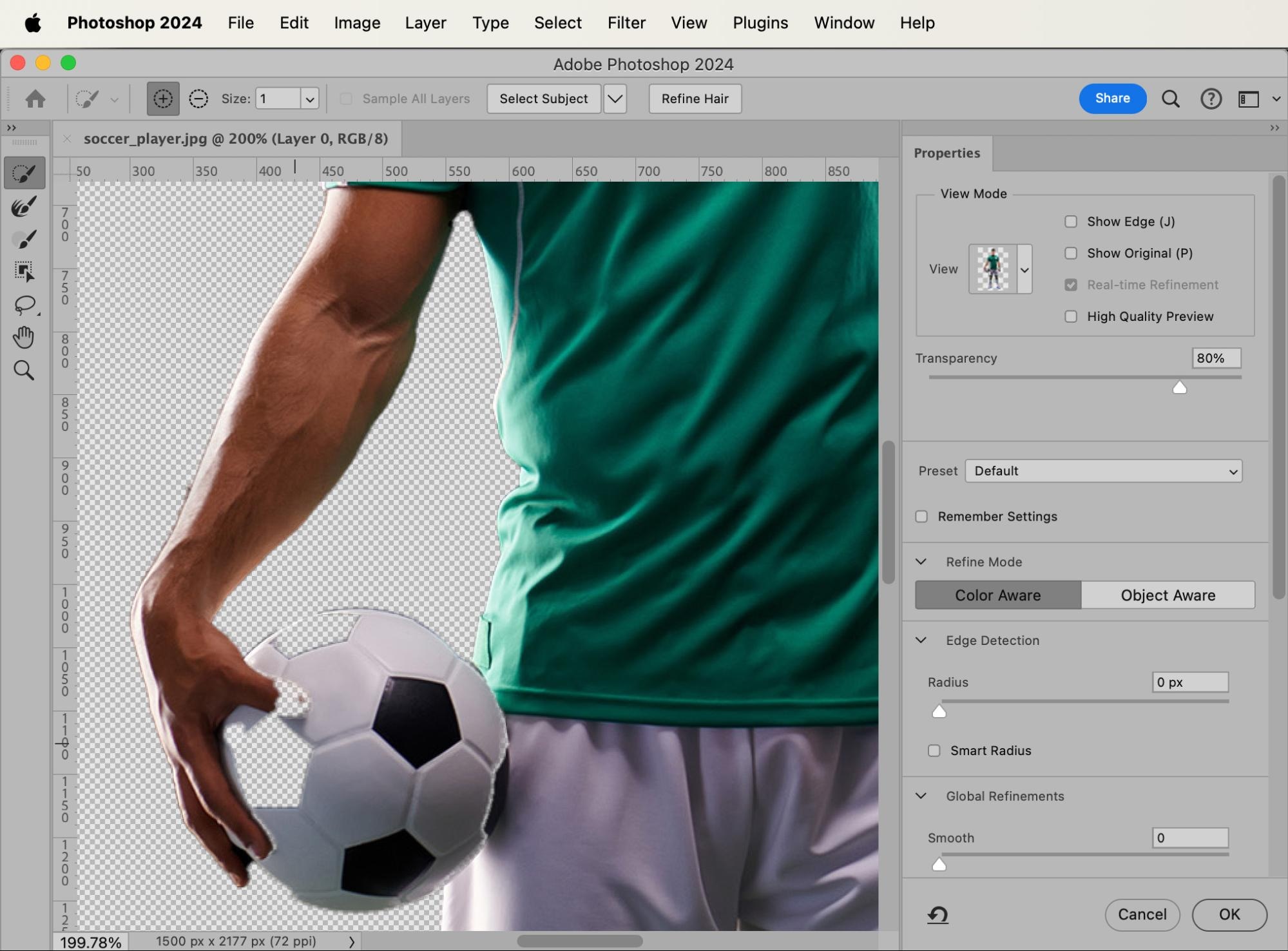 Photoshop editing of a soccer player holding a ball