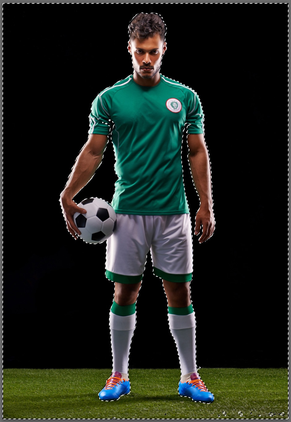 soccer player standing on grass with black background and everything is outlined to be edited in Photoshop