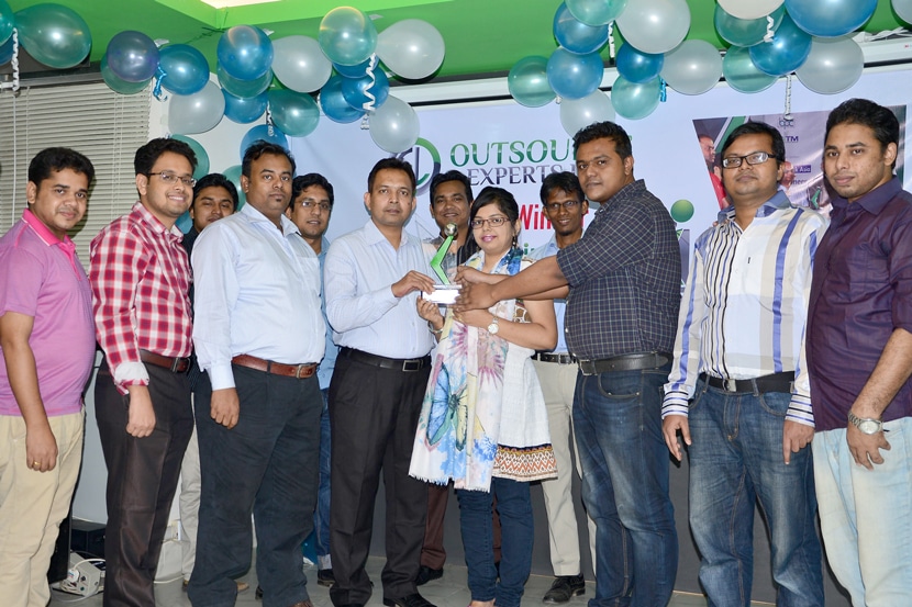 Outsource Experts Ltd. team celebrating BASIS Outsourcing Award with group photo