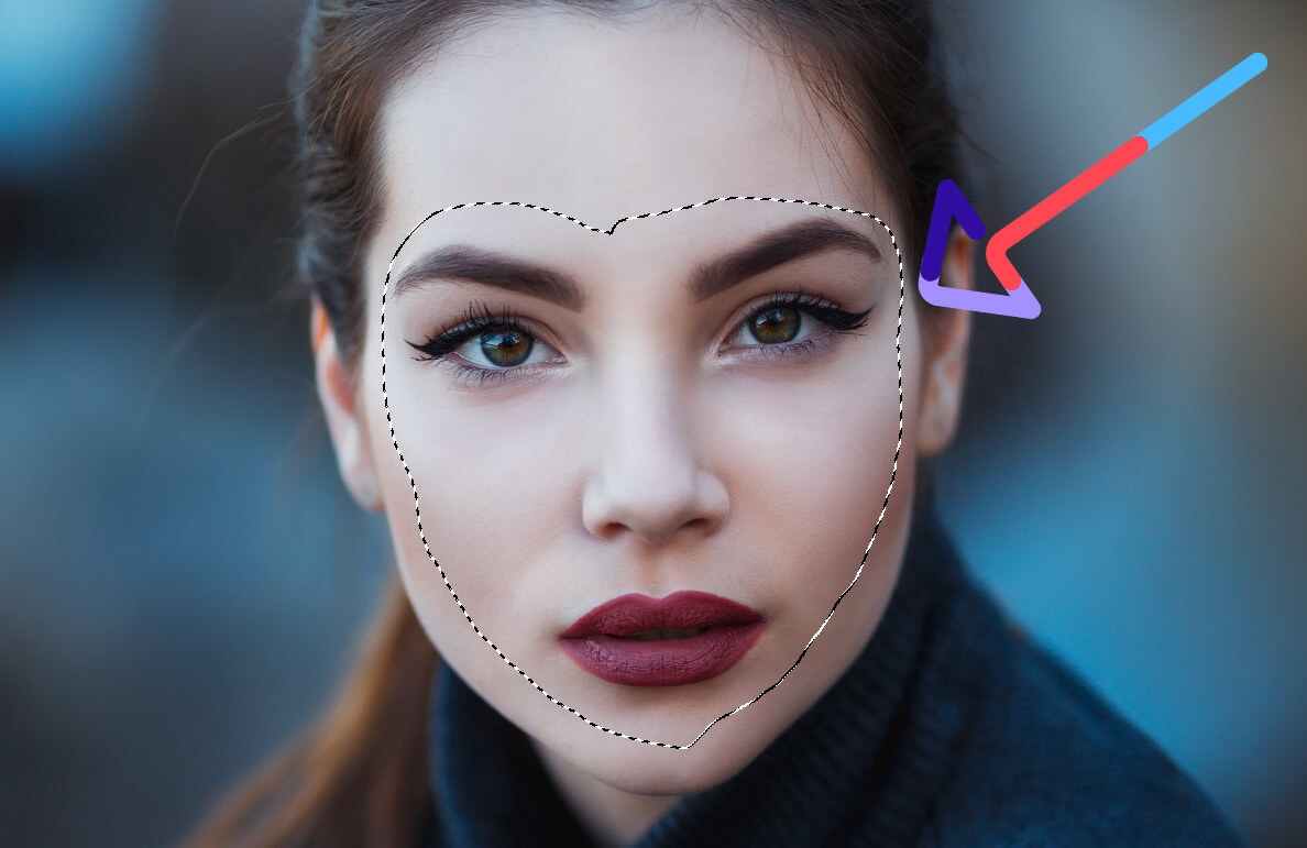 Close-up of woman’s face with selection outline for Photoshop editing, highlighted with an arrow indicator