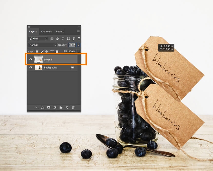 Photoshop Layers panel showing a duplicated layer with blueberries in a jar and tags