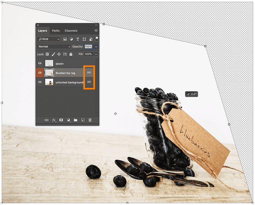 Photoshop Layers panel showing linked layers being transformed together using a distort effect