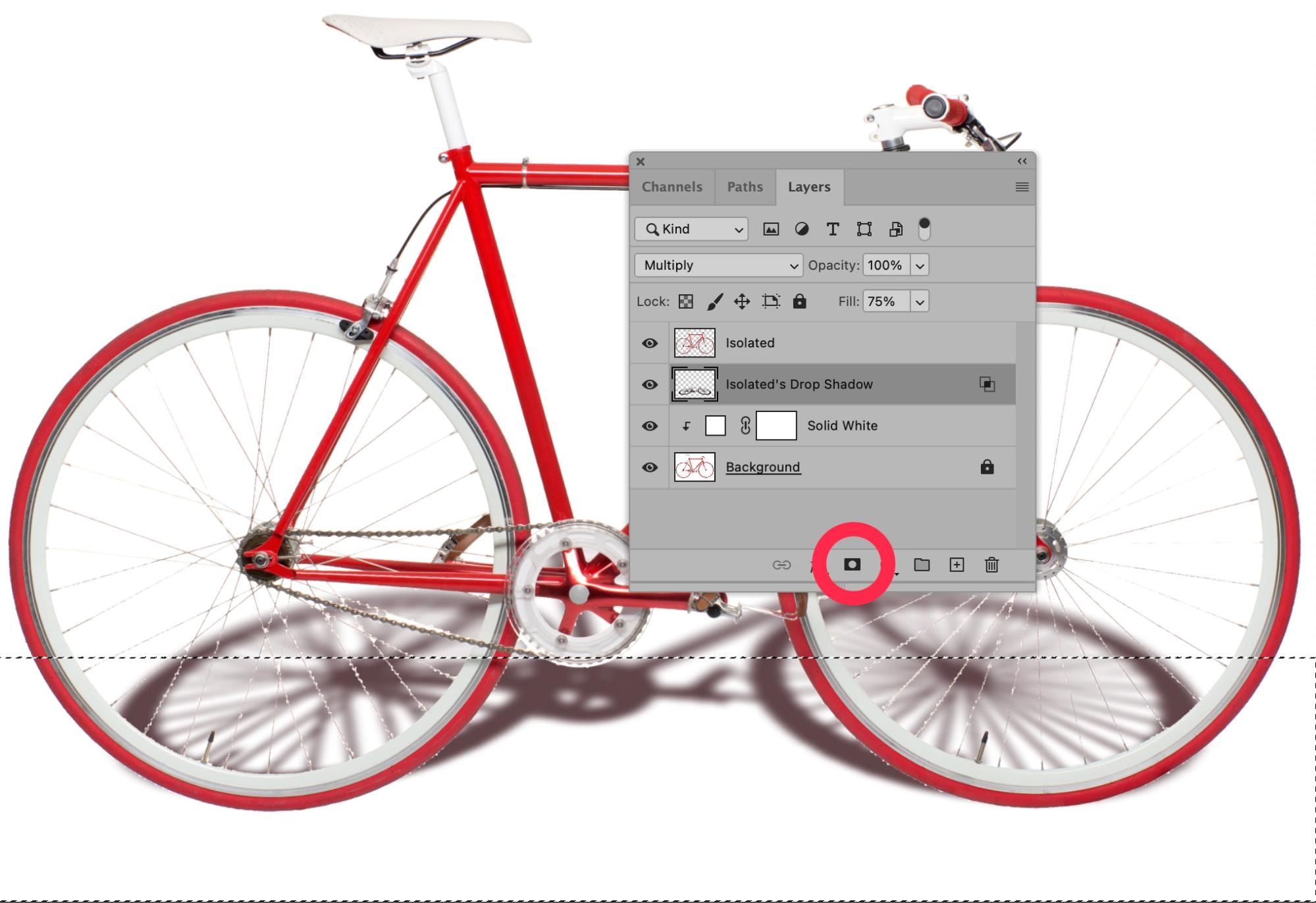 Red bicycle in Photoshop with layer mask applied to drop shadow layer.
