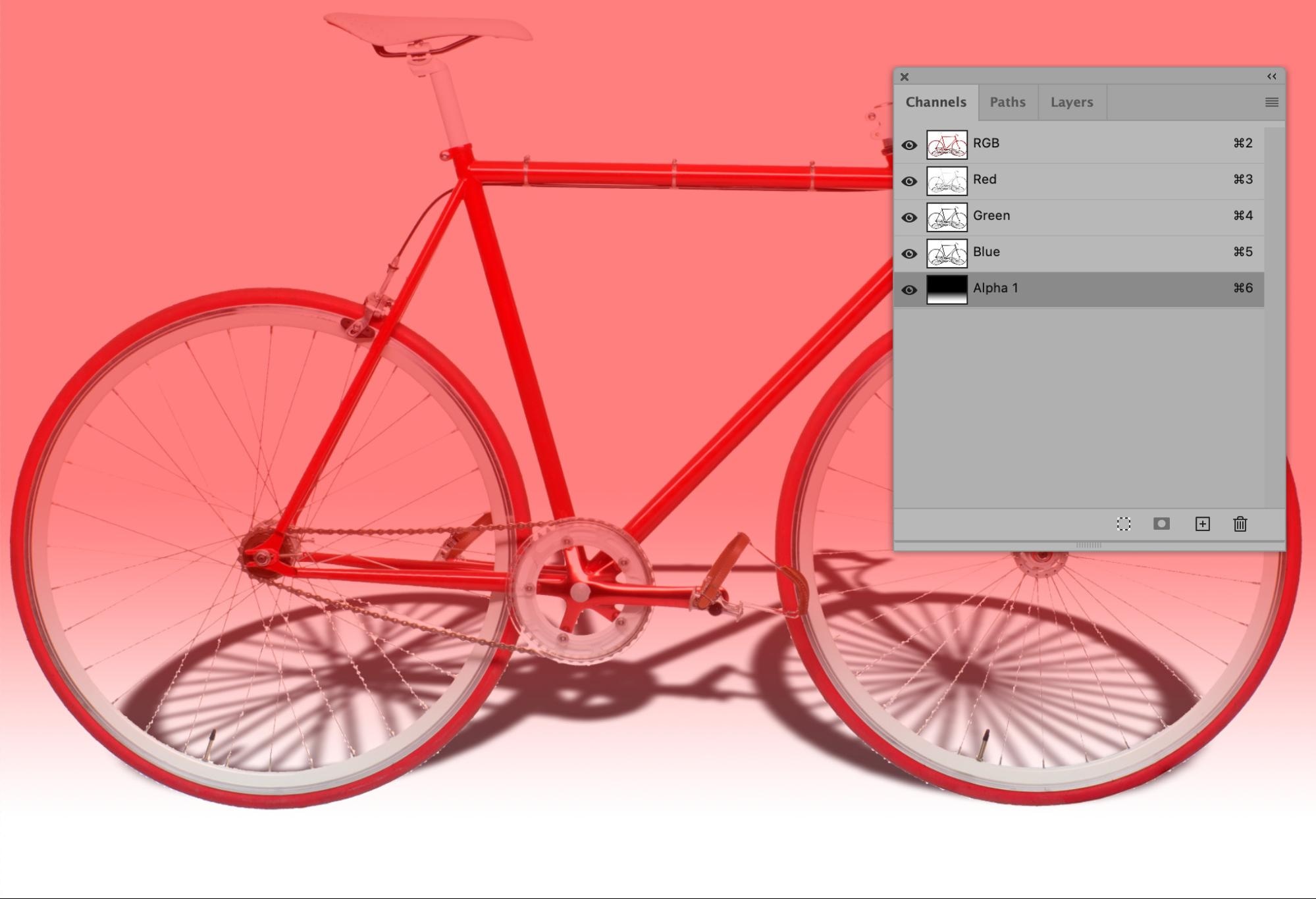 Bicycle image with red overlay applied through Alpha channel in Photoshop interface
