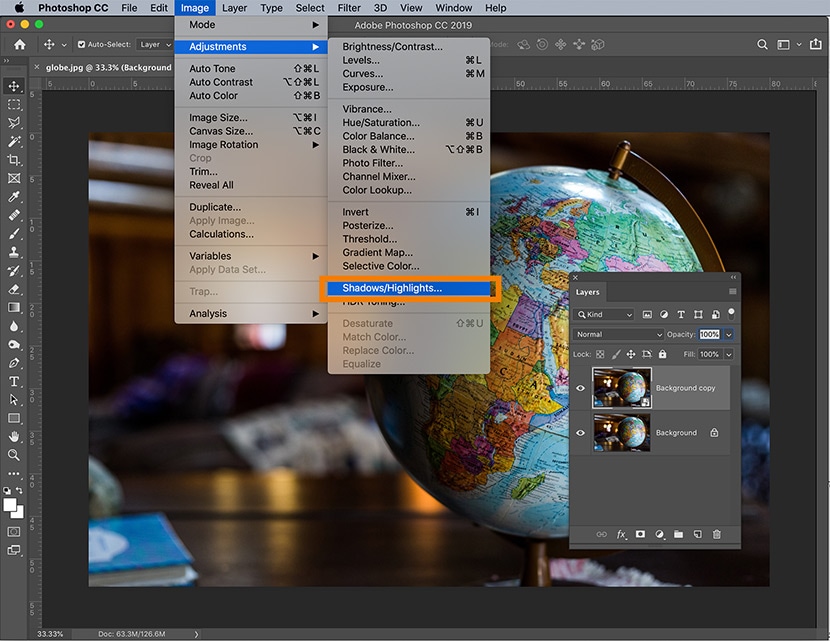 Photoshop interface with Shadows/Highlights adjustment selected for enhancing detail on a globe image.