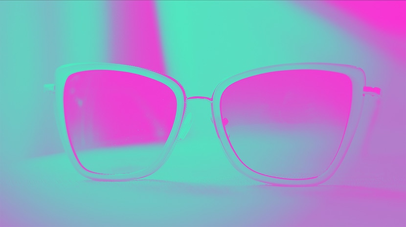 Photo of sunglasses with a vibrant pink and green gradient effect applied, showcasing a bold, retro-inspired color adjustment.