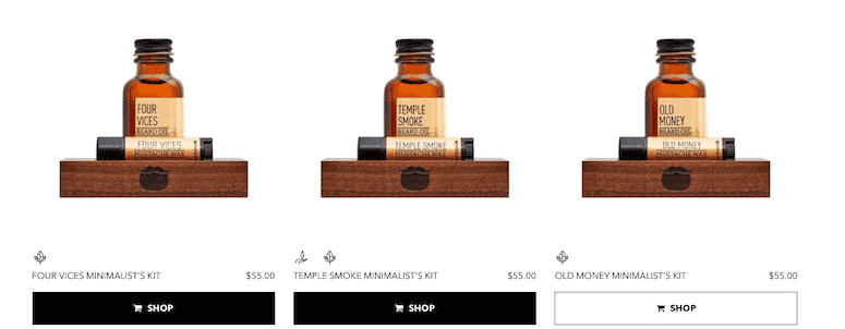 Three variants of Beardbrand Minimalist’s Kit with different scents displayed on wooden stands