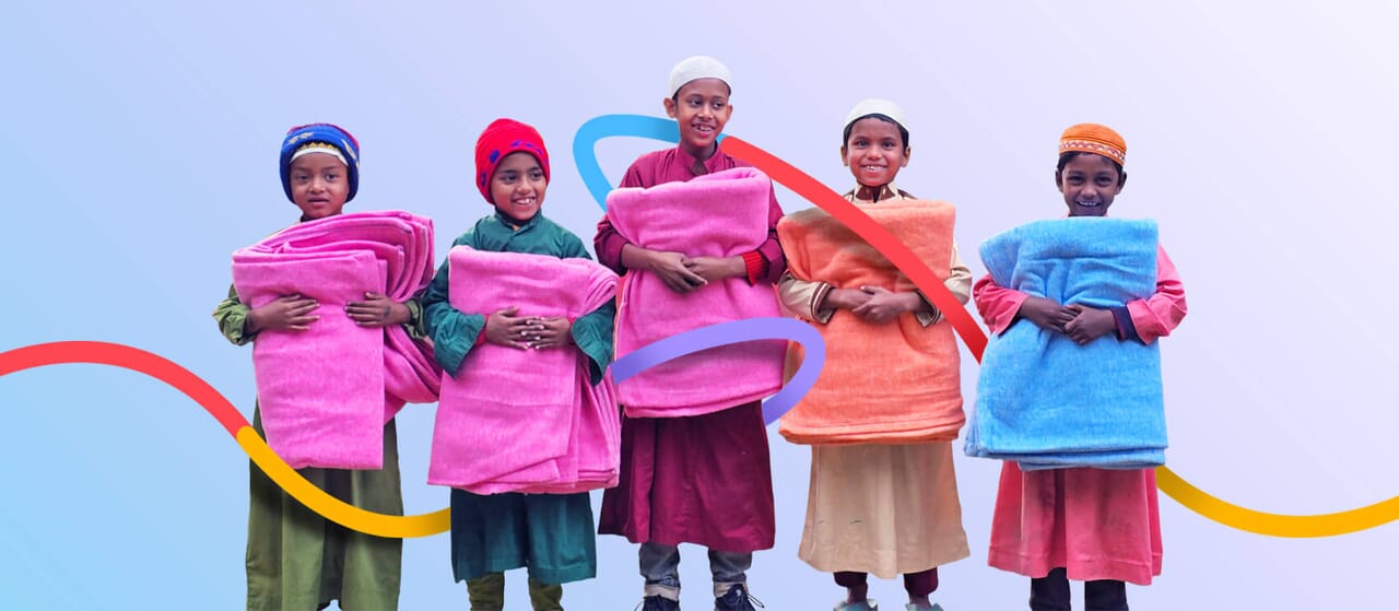 photo of five boys holding blankets and smiling, with a graphic design running through