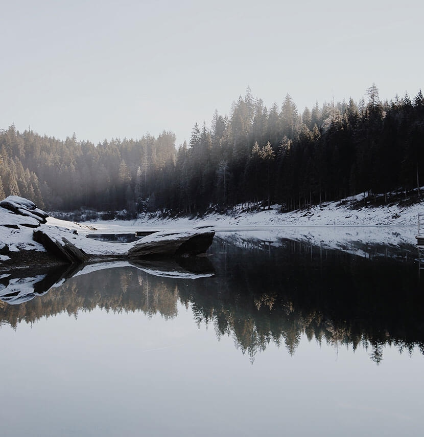 Completed lake landscape image after removing unwanted elements and refining with Photoshop tools.