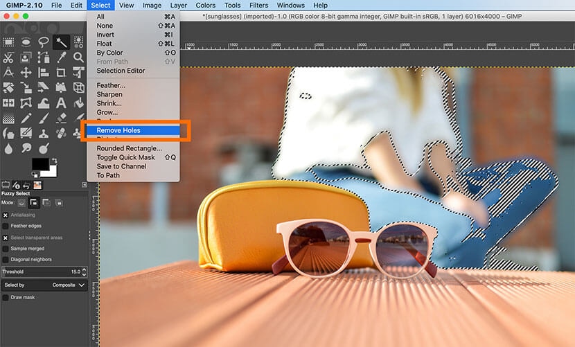 GIMP Select menu with 'Remove Holes' option highlighted to refine background selection around object.