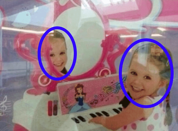 Toy packaging with Photoshop fail showing misaligned child reflection, illustrating poor image editing.