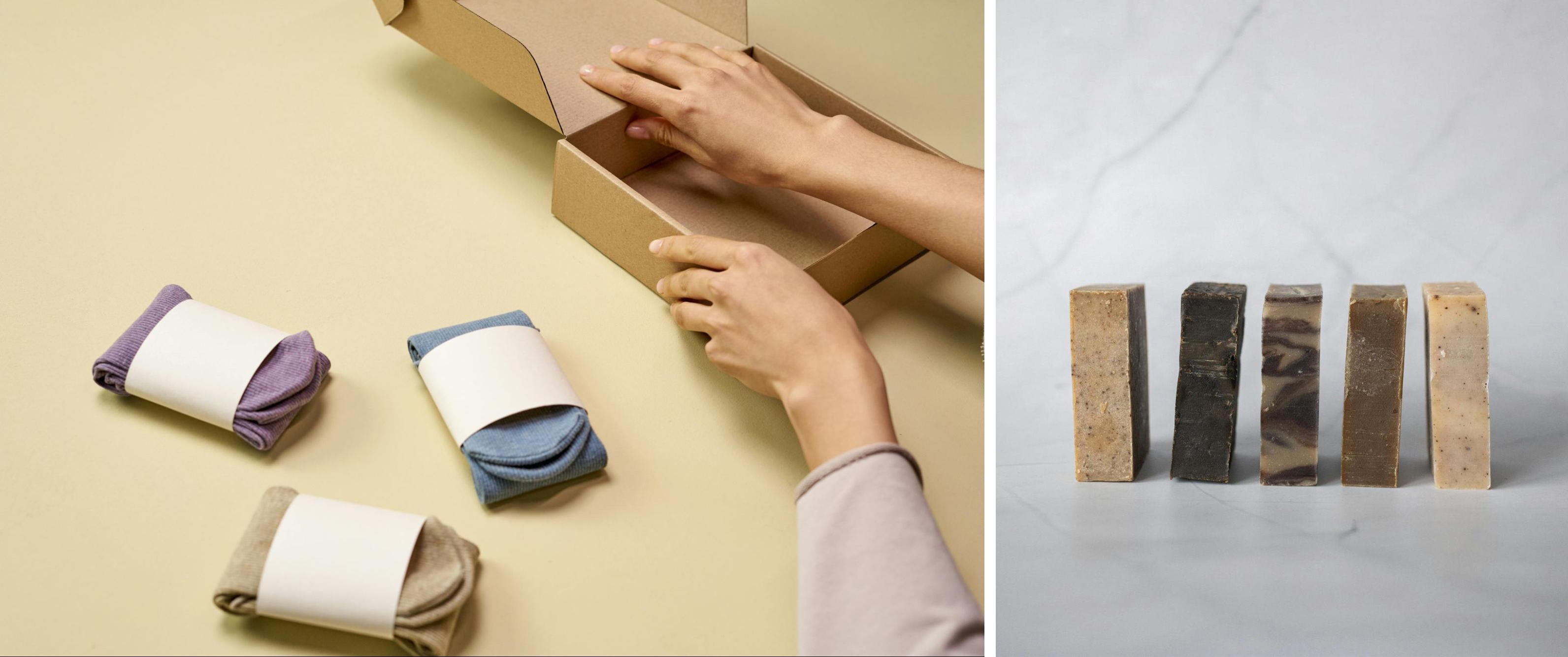 Group product shot featuring three folded socks with blank labels beside open cardboard packaging, and a lineup of five artisanal soap bars on a marble surface—illustrating bundle photography for retail, ecommerce, or promotional product listings.