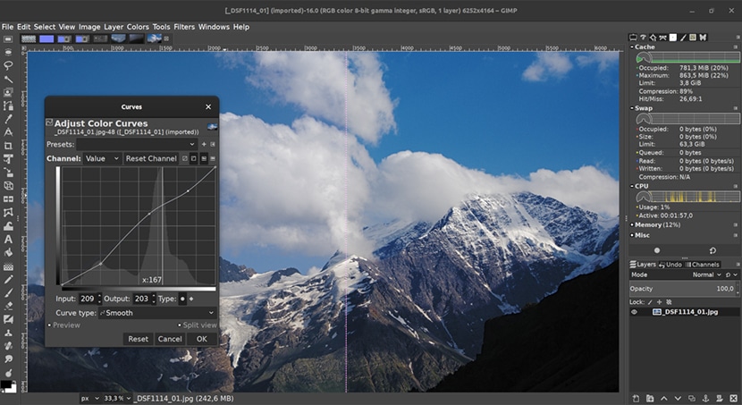 GIMP interface with color curve adjustment tool open, editing a mountain landscape photo for color balance.
