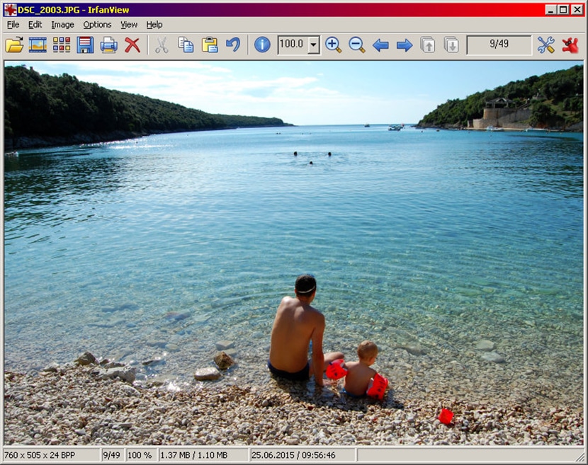 IrfanView interface displaying a beach scene with tools for simple image viewing and basic editing functions.