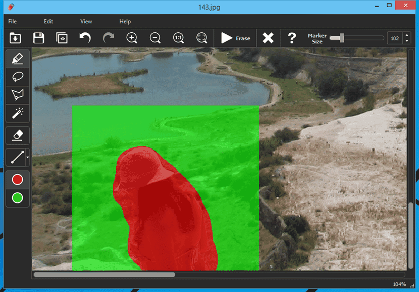 PhotoScissors interface showing background removal in progress with subject highlighted in red and background in green.